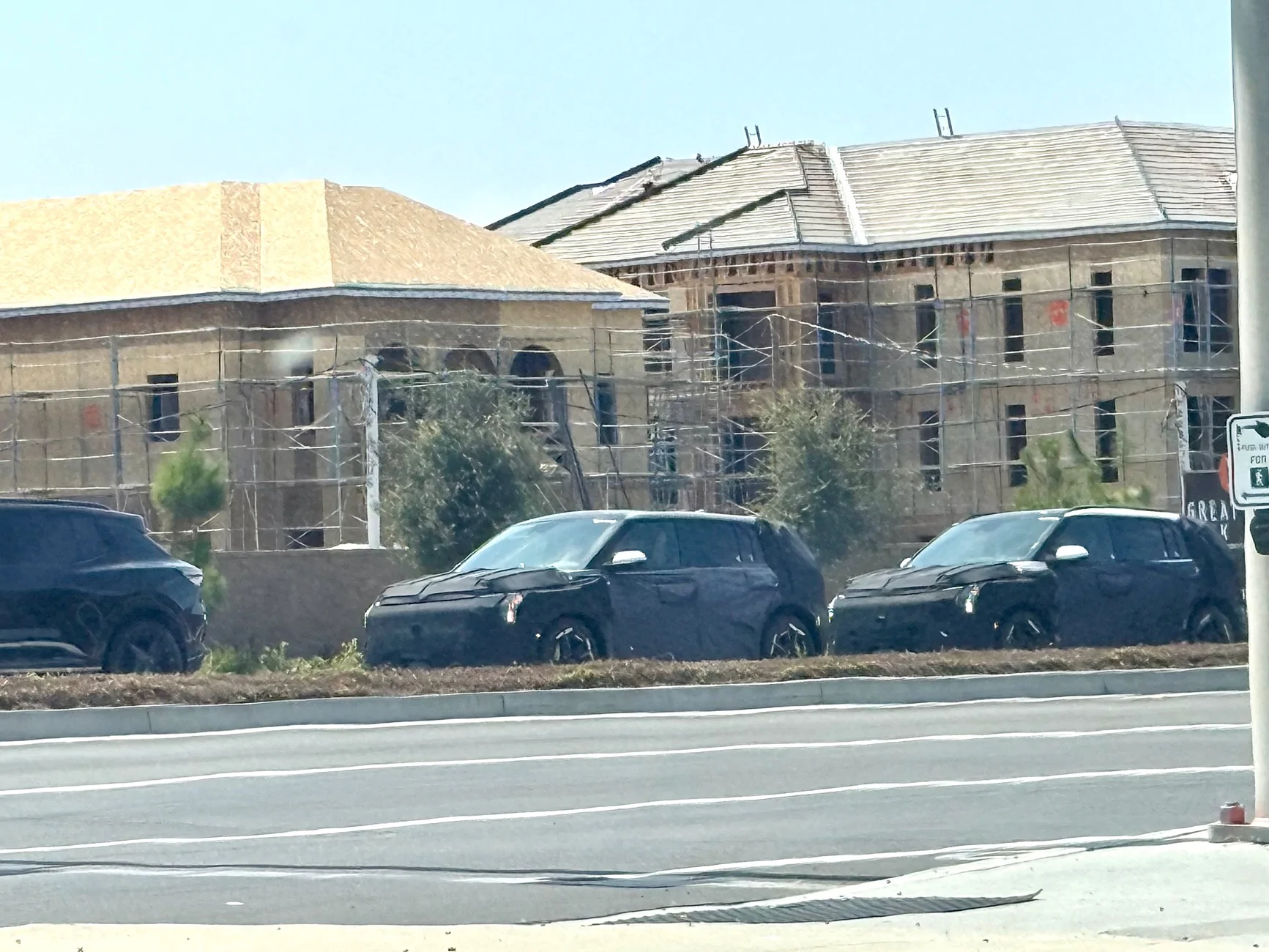 Kia EV3 Spotted: 2027 EV3 testing in US vs. Chevrolet Equinox EV (Irvine, CA  August 2025) IMG_9270